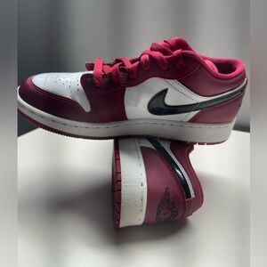 Jordan 1 Low Noble Red Low Top Athletic Sneakers.